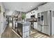 Modern kitchen with white cabinets, granite counters, and stainless steel appliances at 100 Machrie Loop # 17-C, Myrtle Beach, SC 29588