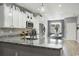 Modern kitchen with white cabinets, granite countertops, and stainless steel appliances at 100 Machrie Loop # 17-C, Myrtle Beach, SC 29588