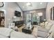 Spacious living room featuring comfortable seating and large windows at 100 Machrie Loop # 17-C, Myrtle Beach, SC 29588