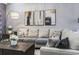 Comfortable living room with sectional sofa and large windows at 100 Machrie Loop # 17-C, Myrtle Beach, SC 29588