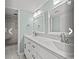 Modern bathroom with dual vanities and a tiled walk-in shower at 100 Ocean Creek Blvd. # J1, Myrtle Beach, SC 29572