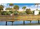 Picturesque boardwalk over the water showcasing serene views and couples enjoying a stroll at 100 Ocean Creek Blvd. # J1, Myrtle Beach, SC 29572