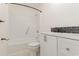 A bathroom features sleek black and white tile, modern vanity with silver hardware and shower-tub combo at 1025 Carolina Rd. # Y-1, Conway, SC 29526