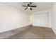 Bedroom features carpet flooring, a ceiling fan, closet and entrance to the hallway at 1025 Carolina Rd. # Y-1, Conway, SC 29526