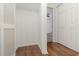 Walk-in closet with laminate wood floors, access to storage, and view into bedroom at 1025 Carolina Rd. # Y-1, Conway, SC 29526