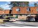 Charming brick townhouse featuring unique wood roofing, green shutters and door, and ample parking space at 1025 Carolina Rd. # Y-1, Conway, SC 29526