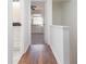 The hallway connects the bedroom and bathroom with classic hardwood flooring at 1025 Carolina Rd. # Y-1, Conway, SC 29526