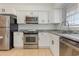 Modern kitchen featuring stainless steel appliances, white cabinets, and granite countertops at 1025 Carolina Rd. # Y-1, Conway, SC 29526