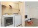 Laundry room with a view of the fireplace, washer, dryer, and ample storage space at 1025 Carolina Rd. # Y-1, Conway, SC 29526