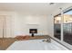 Cozy living room featuring a modern fireplace, sliding glass door, and neutral carpet at 1025 Carolina Rd. # Y-1, Conway, SC 29526