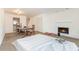 Open-concept living room with a view to the kitchen and a modern fireplace at 1025 Carolina Rd. # Y-1, Conway, SC 29526