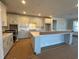 Modern kitchen with white cabinets and large island at 1108 Oxeye St., North Myrtle Beach, SC 29582