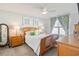 Cozy bedroom with wood bed frame, nightstands, and decorative pillows at 124 Golden Bear Circle, Longs, SC 29568