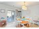 Casual dining area with a round table and chairs near sliding door at 124 Golden Bear Circle, Longs, SC 29568