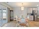 Bright dining area with wood table and chairs, access to backyard at 124 Golden Bear Circle, Longs, SC 29568