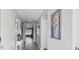 Long hallway leading to living areas with hardwood floors at 124 Golden Bear Circle, Longs, SC 29568