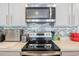 Modern kitchen with stainless steel appliances and a stylish backsplash at 124 Golden Bear Circle, Longs, SC 29568