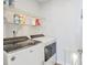Convenient laundry room with washer, dryer and shelving at 124 Golden Bear Circle, Longs, SC 29568