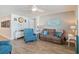 Living area with teal armchairs and brown sofa at 124 Golden Bear Circle, Longs, SC 29568