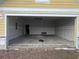 Unfinished two-car garage with drywall and concrete floor at 1264 Lady Bird Way, North Myrtle Beach, SC 29582