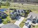 Expansive aerial view of the property featuring a well-manicured lawn, pond, and proximity to the highway at 1422 Bohicket Ct., Myrtle Beach, SC 29579