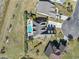 Aerial view of a home's backyard with a sparkling pool, lounge area, and manicured landscaping at 1422 Bohicket Ct., Myrtle Beach, SC 29579