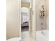Cozy bathroom with a bathtub and shower combination, with a view into an adjacent bedroom at 1422 Bohicket Ct., Myrtle Beach, SC 29579