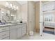 Bathroom featuring a vessel sink, granite counters, and a view into the bedroom at 1422 Bohicket Ct., Myrtle Beach, SC 29579