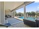 Spacious covered patio with brick flooring, overlooking a sparkling pool and well-maintained landscaping at 1422 Bohicket Ct., Myrtle Beach, SC 29579