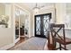Elegant entry way with hardwood floors, a stylish light fixture, and a view into the office at 1422 Bohicket Ct., Myrtle Beach, SC 29579