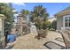 Outdoor fireplace and seating area on a brick patio with palm trees at 1422 Bohicket Ct., Myrtle Beach, SC 29579