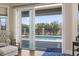 Patio view through open sliding glass doors reveals a refreshing pool and lush landscaping at 1422 Bohicket Ct., Myrtle Beach, SC 29579