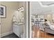 Stylish powder room featuring a vessel sink, granite countertops, and modern lighting, adjacent to an open kitchen and living area at 1422 Bohicket Ct., Myrtle Beach, SC 29579