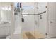 Beautiful glass shower with stone flooring, updated fixtures, and convenient built-in shelving for toiletries at 1422 Bohicket Ct., Myrtle Beach, SC 29579
