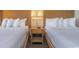 Two double beds with a nightstand in between at 1501 S Ocean Bl S Ocean Blvd. # 549, Myrtle Beach, SC 29577