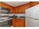 Well-equipped kitchen featuring wood cabinets and a stove top at 1501 S Ocean Bl S Ocean Blvd. # 549, Myrtle Beach, SC 29577