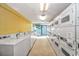 Well-lit laundry room with numerous washers and dryers at 1501 S Ocean Bl S Ocean Blvd. # 549, Myrtle Beach, SC 29577