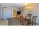 Living room with sofa, dining table, and access to hallway at 1501 S Ocean Bl S Ocean Blvd. # 549, Myrtle Beach, SC 29577