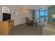 Living room with ocean view, sofa, dining table, and balcony access at 1501 S Ocean Bl S Ocean Blvd. # 549, Myrtle Beach, SC 29577