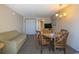 Living room with sofa, dining table, and access to hallway at 1501 S Ocean Bl S Ocean Blvd. # 549, Myrtle Beach, SC 29577