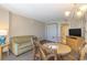 Living room with sofa, dining table, and access to hallway at 1501 S Ocean Bl S Ocean Blvd. # 549, Myrtle Beach, SC 29577