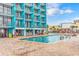 Large outdoor pool with a Tiki bar and lounge area at 1501 S Ocean Bl S Ocean Blvd. # 549, Myrtle Beach, SC 29577