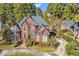 Two-story brick home with circular driveway and mature trees at 1524 Brookgreen Dr., Myrtle Beach, SC 29577