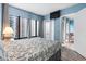 Spacious bedroom with a queen bed and access to balcony at 1605 S Ocean Blvd. # 414, Myrtle Beach, SC 29577