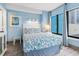 Cozy bedroom with a full-size bed and large window at 1605 S Ocean Blvd. # 414, Myrtle Beach, SC 29577