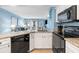 Modern kitchen with black appliances and granite countertops at 1605 S Ocean Blvd. # 414, Myrtle Beach, SC 29577