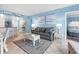 Open living space with gray sofa and white coffee table at 1605 S Ocean Blvd. # 414, Myrtle Beach, SC 29577