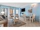 Living room with tiled floor, comfy seating, and balcony access at 1605 S Ocean Blvd. # 414, Myrtle Beach, SC 29577