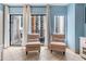 Bright living room with two armchairs and balcony access at 1605 S Ocean Blvd. # 414, Myrtle Beach, SC 29577