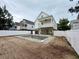 Backyard with a pool under construction and neighboring homes at 1718 26Th Ave. N, North Myrtle Beach, SC 29582